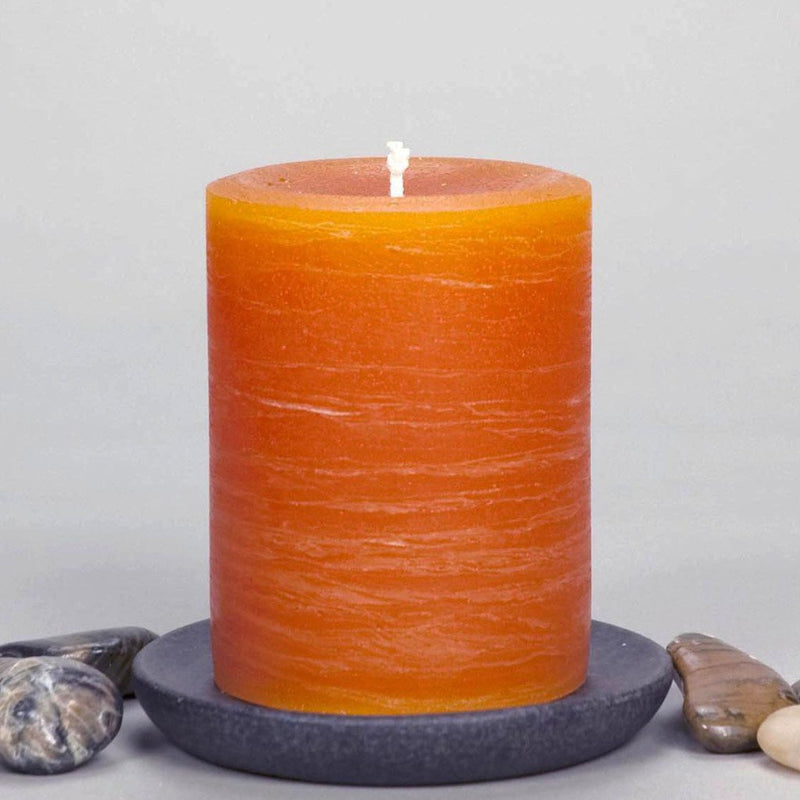 orange pillar candle part of rustic candle collection available in sizes 3x4 3x6 3x9 4x6 4x9 hand poured artisan candles by Nordic Candle